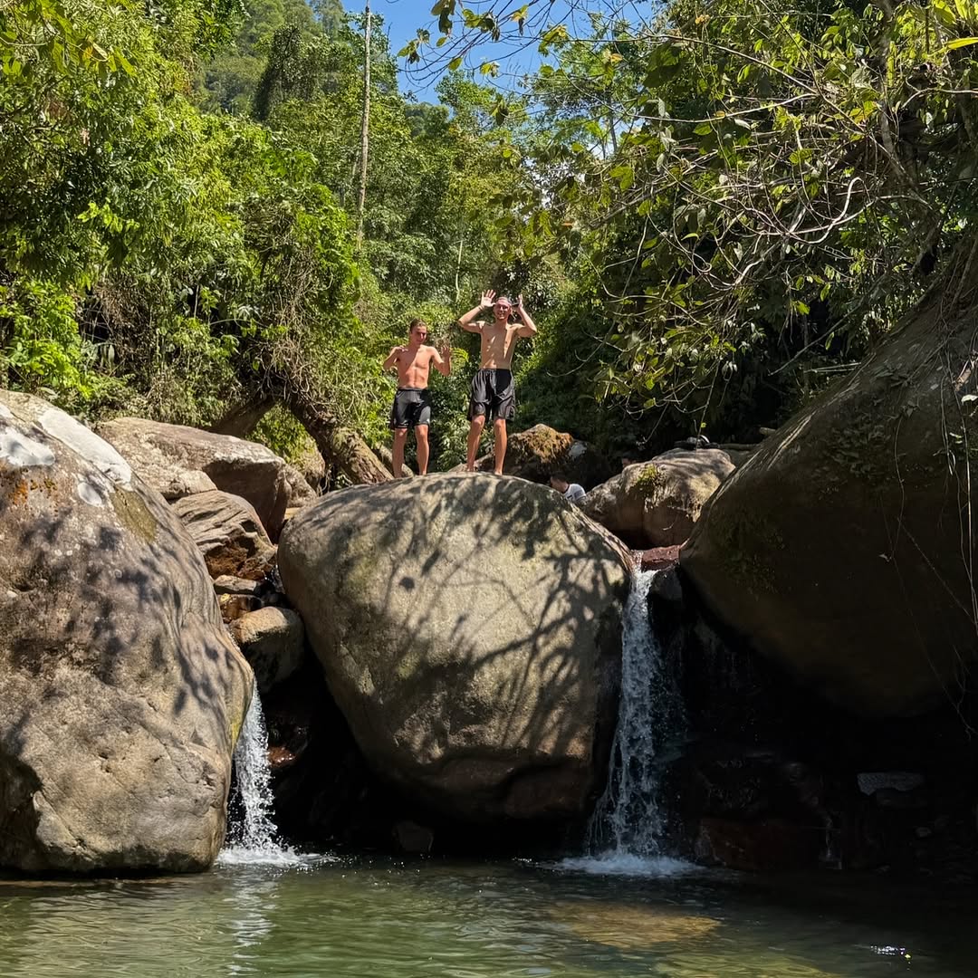 rushing waters of Ba Tien Waterfall during a Ha Giang motorbike loop tour.